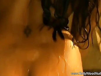 Indian honey is dancing and leisurely taking off her clothes, knowing that someone is witnessing her