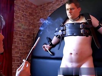 Horny babe is sexually desecrating this nasty guy slapping his seductive body